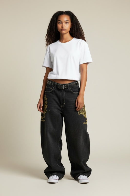 SWAGTOK black denim straight-leg jeans with distressed details and retro jazz print.