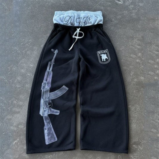 SWAGTOK black polyester sweatpants with double waistband, drawstring, AK-47 graphic print, and embroidered logo.