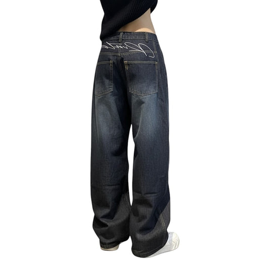 SWAGTOK vintage blue high waist baggy denim jeans with distressed finish and embroidered details.