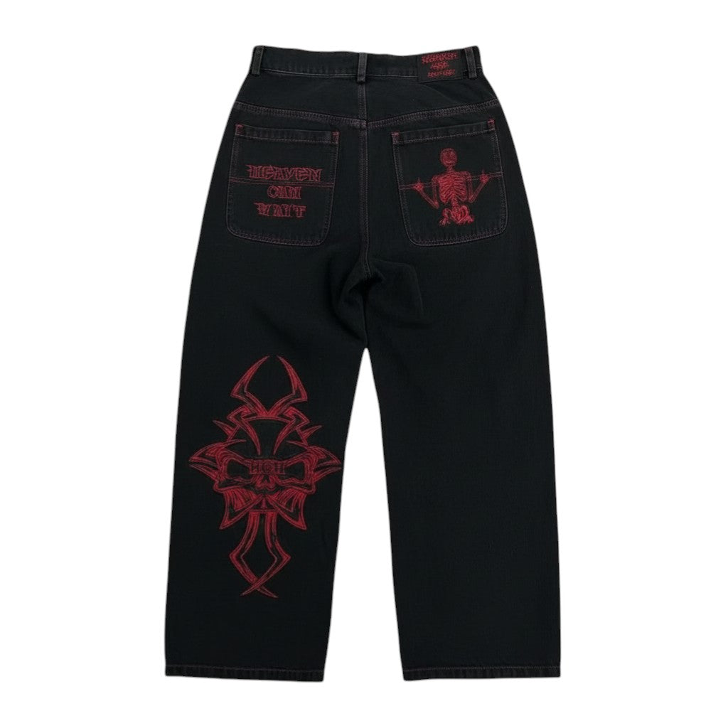 SWAGTOK black cotton straight-leg pants with red skull embroidery on leg and back pocket.