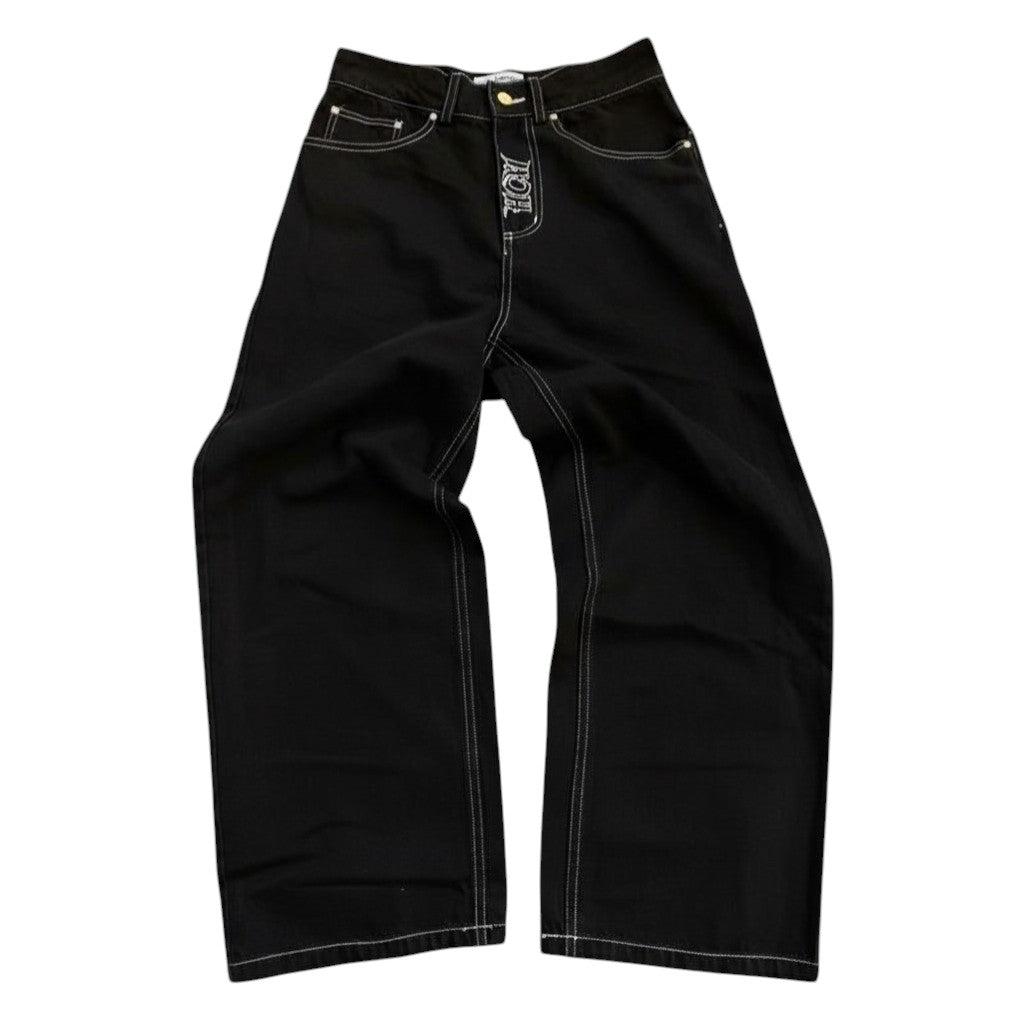 SWAGTOK men's black denim jeans with white contrast stitching and zipper fly, retro casual style.
