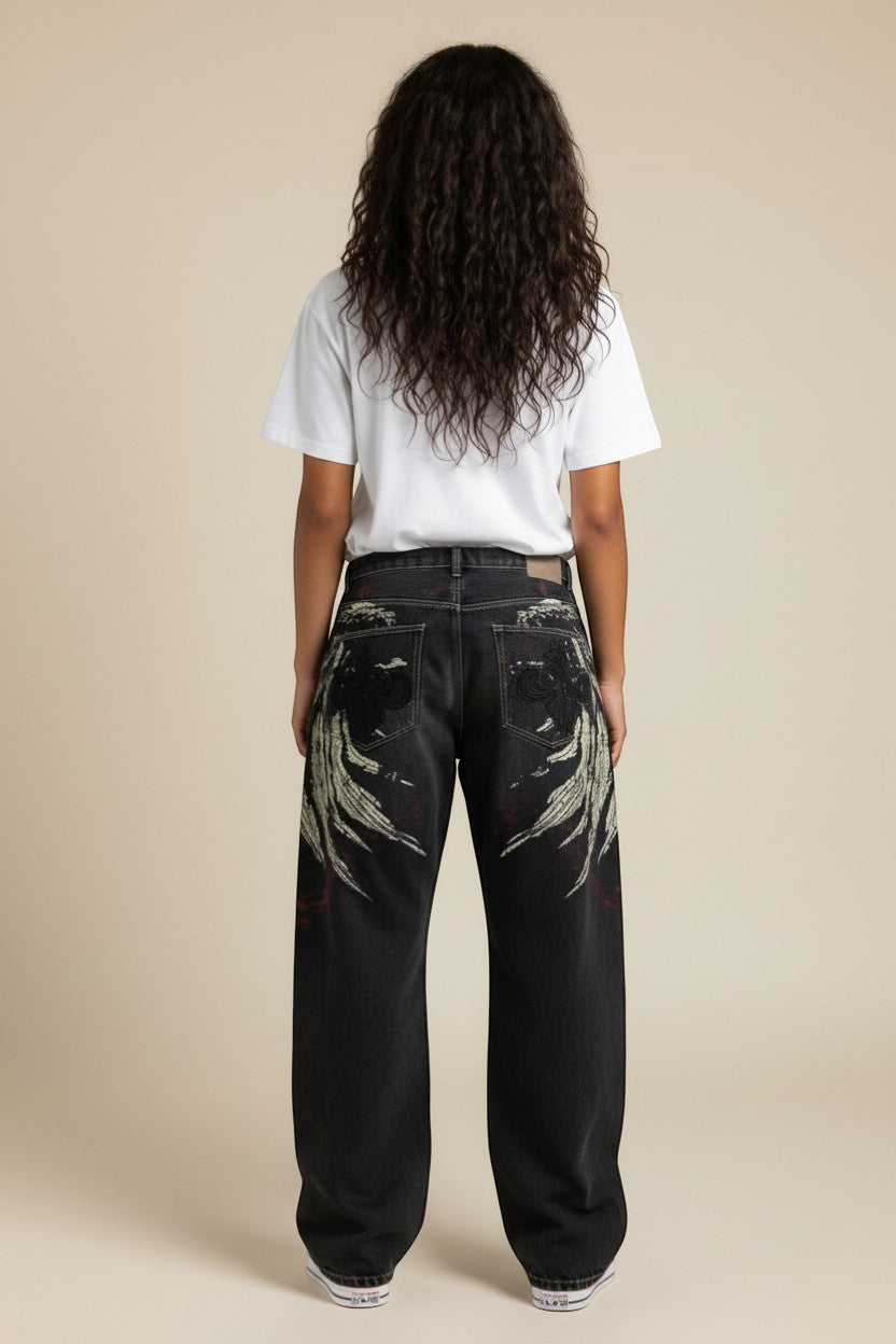 SWAGTOK men's loose fit black denim jeans with embroidered wing design and red accents.