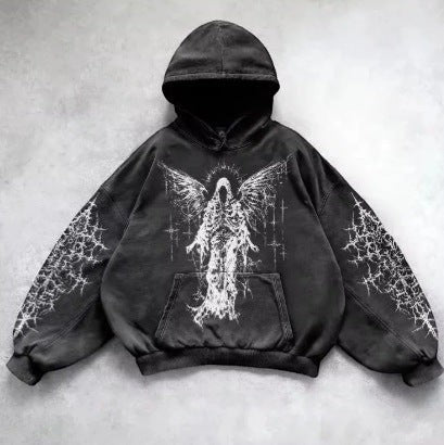 SWAGTOK black cotton hoodie with a distressed graphic print of a winged skeletal figure and abstract patterns on the sleeves.