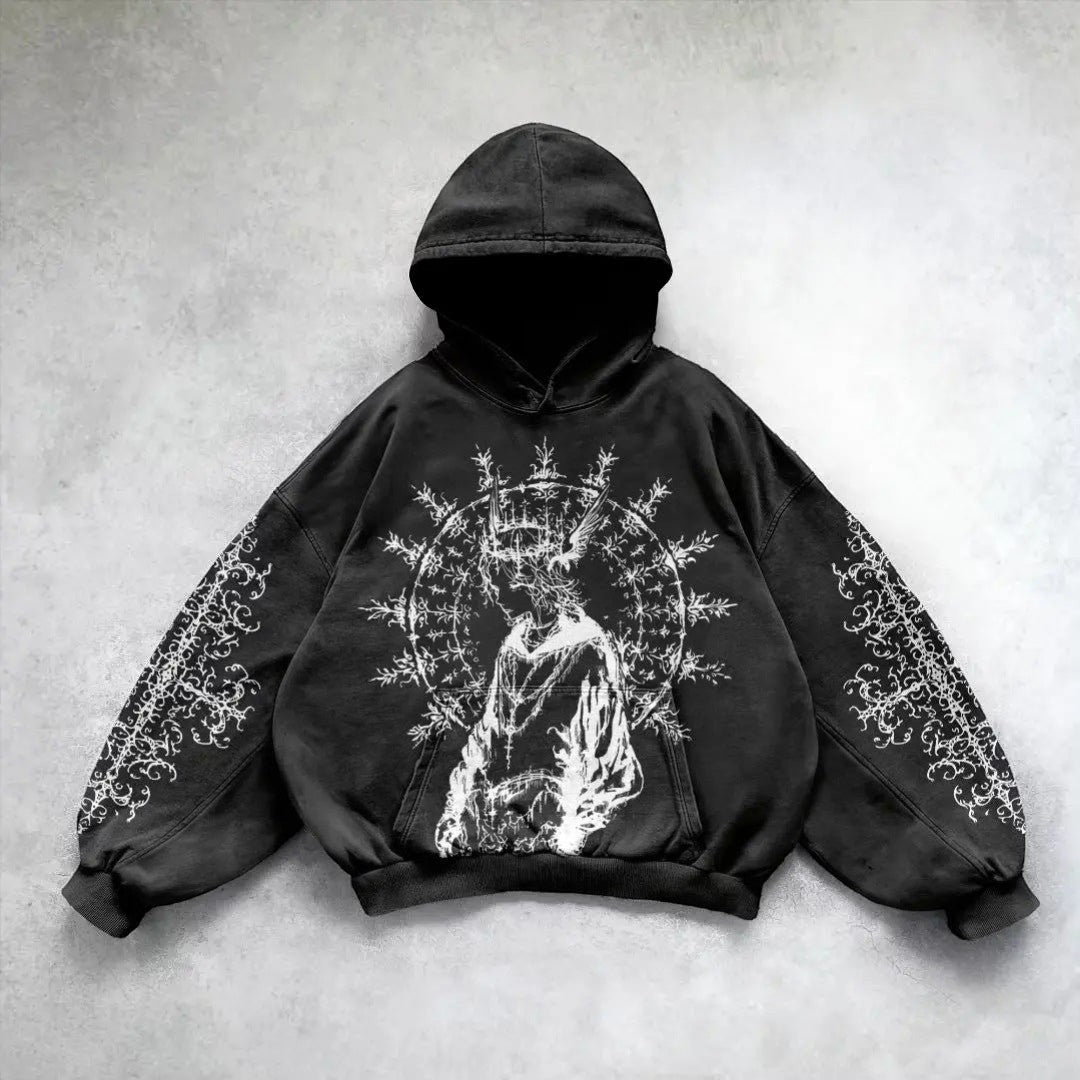 SWAGTOK black cotton hoodie with hand-painted graphic art and ornate sleeve details. Y2K street style.