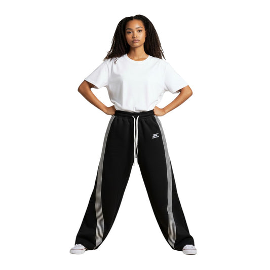 SWAGTOK black polyester blend sweatpants with white side stripes and drawstring waist. Features batwing sleeves and Harajuku style.