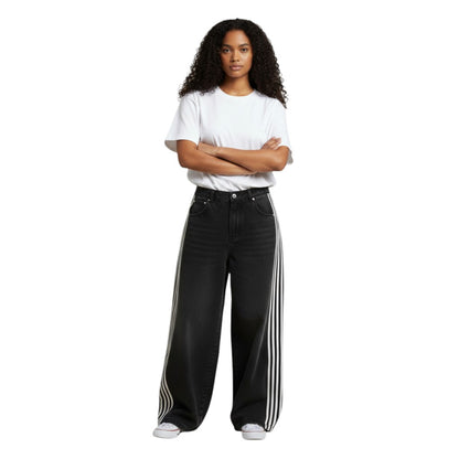 SWAGTOK black denim wide-leg jeans with white side stripes, mid-waist, zip fly, for daily wear.