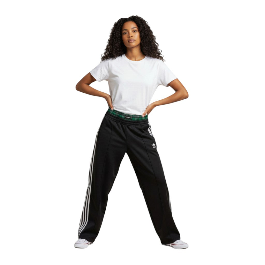 SWAGTOK black cotton blend straight leg track pants with white side stripes and green plaid waistband.