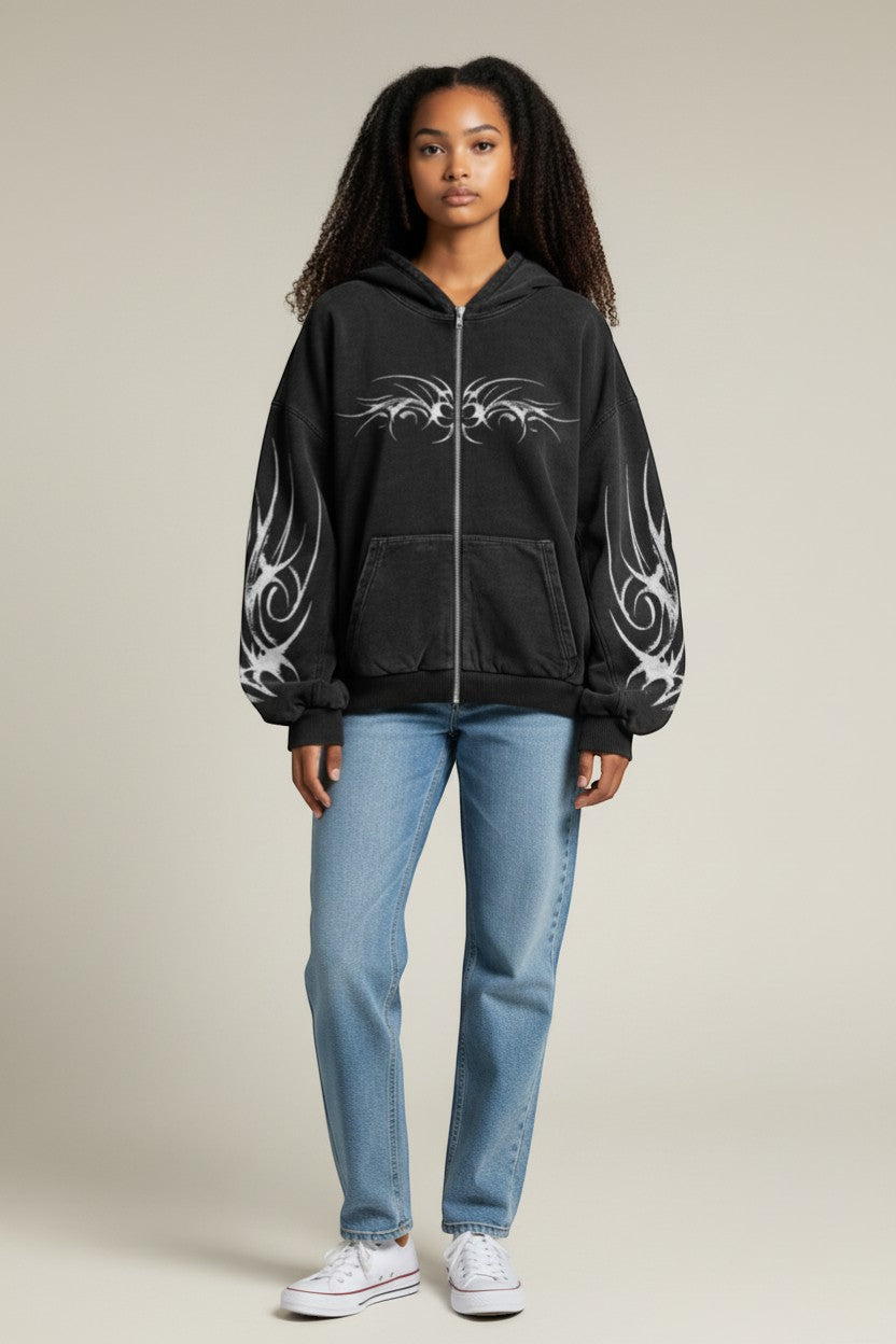 SWAGTOK black oversized zip-up hoodie with tribal graphic print on chest and sleeves, made of polyester fiber.