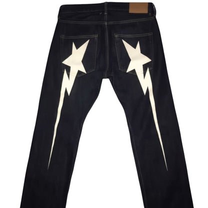 SWAGTOK men's black wide leg jeans with white lightning bolt star graphic on back pockets.