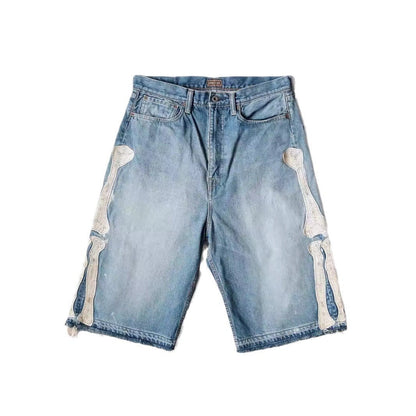 SWAGTOK light blue denim shorts with white embroidered bone details on the sides, straight leg, summer hip hop style.