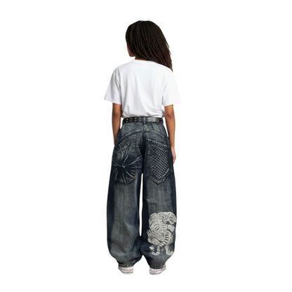 SWAGTOK blue denim wide leg jeans with high waist and white tiger print on the leg.