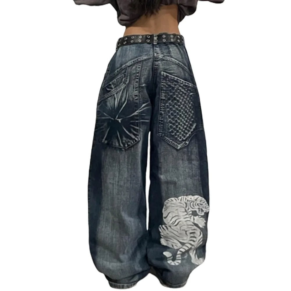 SWAGTOK blue denim wide leg jeans with high waist and white tiger print on the leg. Hip hop style.
