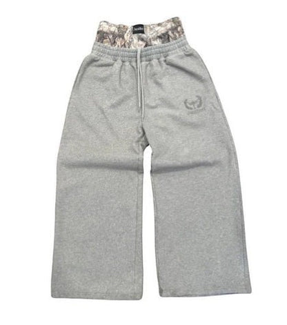 SWAGTOK gray cotton loose-fit trousers with embroidered logo and camouflage double waist detail.