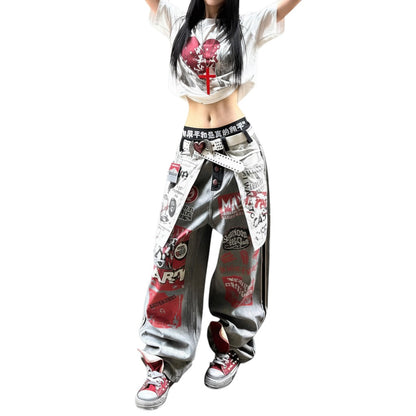 SWAGTOK gray washed denim jeans with a relaxed fit, high waist, and punk-inspired graphic details. Straight-leg cut.
