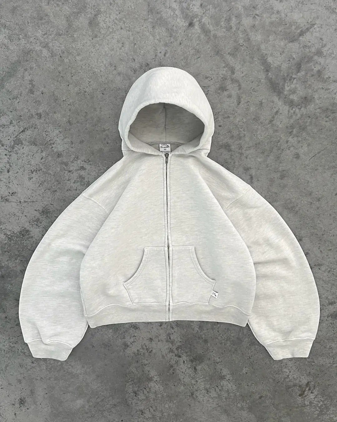 SWAGTOK light grey 100% cotton zip-up hoodie with pockets and loose fit.