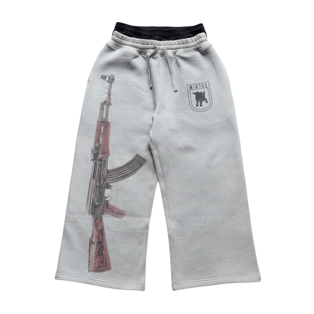 SWAGTOK light grey polyester sweatpants with double waistband, AK-47 graphic print on left leg and logo on right.