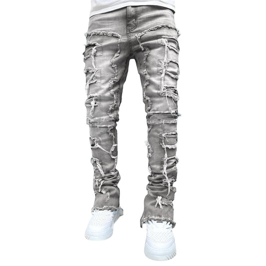 SWAGTOK men's light grey stacked jeans with distressed rips and frayed hems, made of cotton.