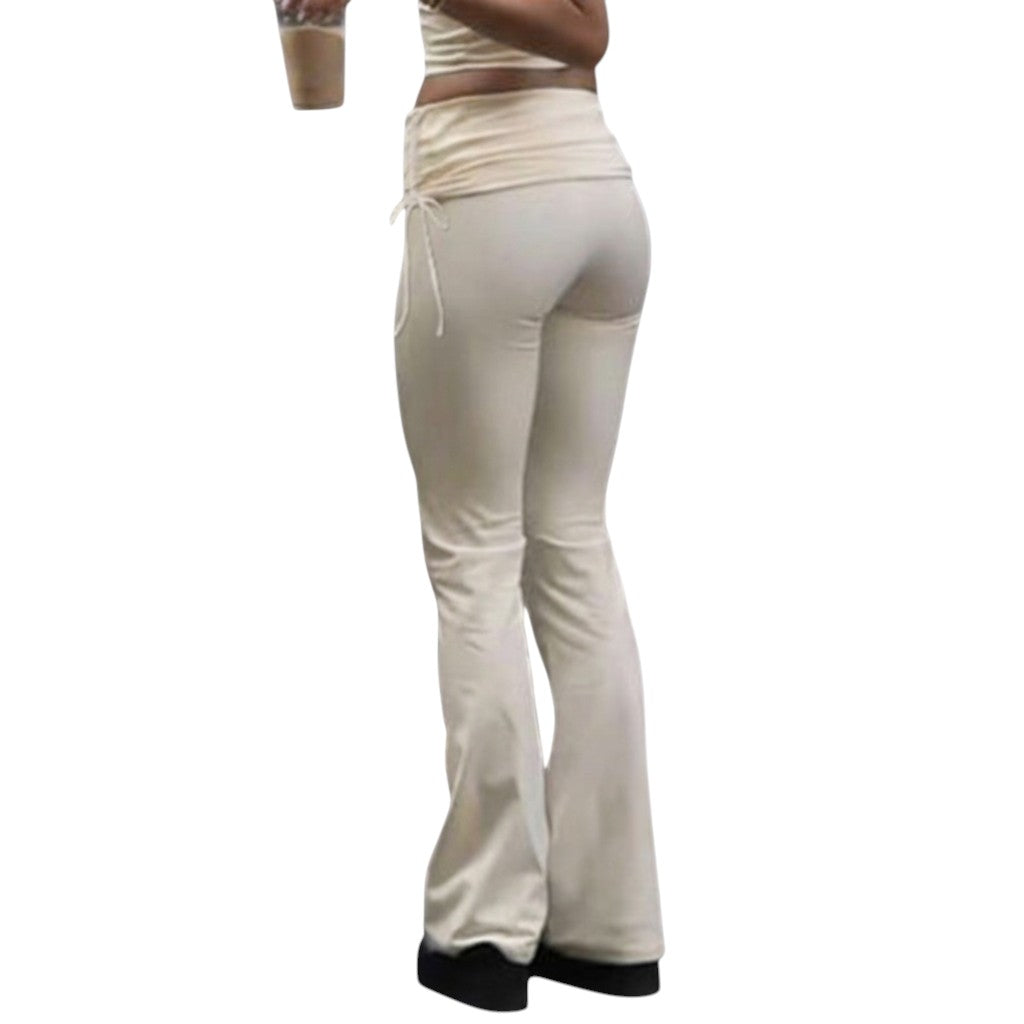 SWAGTOK light yellow low-waist bootcut trousers made of knitted polyester with lace-up detail.