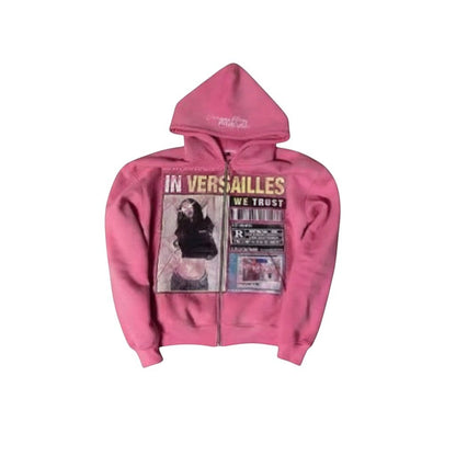 SWAGTOK pink polyester zip-up hoodie with "IN VERSAILLES WE TRUST" graphic print and 3D effect.