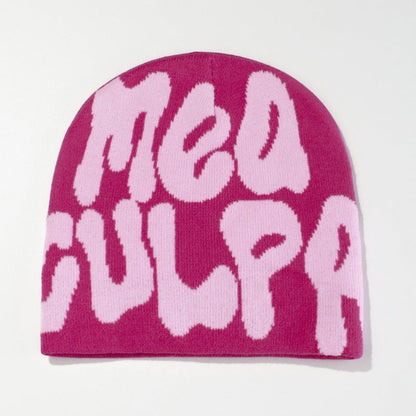 SWAGTOK pink acrylic knit beanie with contrasting light pink bubble lettering spelling 'Mea Culpa'. Machine embroidered, thermal, and windproof.