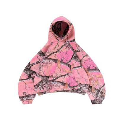 SWAGTOK pink polyester hoodie with a camouflage pattern of trees and leaves, featuring a front pocket and hood.