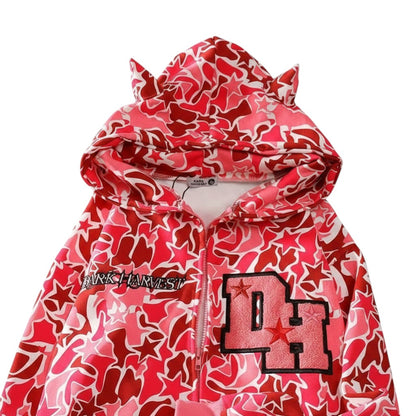 SWAGTOK pink and red camouflage print zip-up hoodie with star pattern and "DH" graphic.