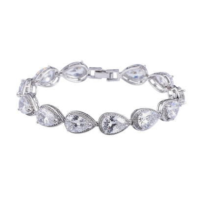 SWAGTOK platinum plated bracelet with drop-shaped white zircon stones and geometric design.
