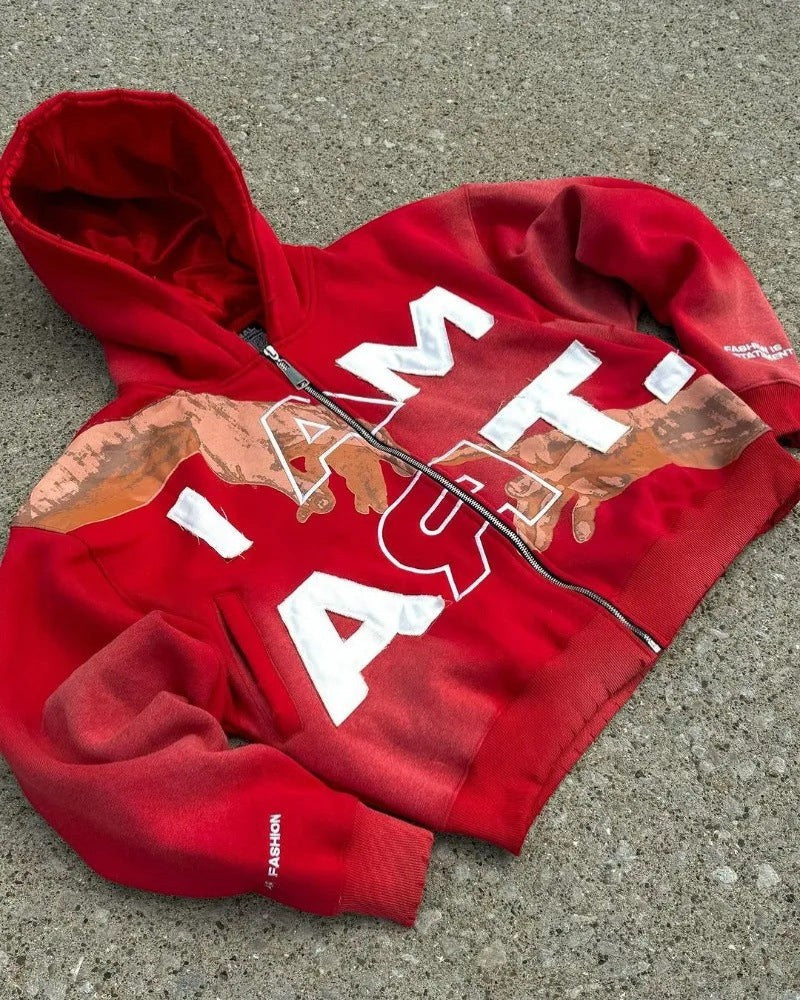 SWAGTOK red cotton blend hooded zip-up sweatshirt with white "I AM ART" graphic and distressed details.
