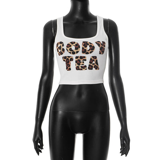 SWAGTOK white polyester halter neck sleeveless crop top with leopard print "BODY TEA" graphic. Street fashion style.