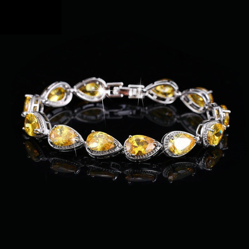 SWAGTOK yellow drop-shaped zircon tennis bracelet, platinum-plated copper, geometric design, 17.8cm length.