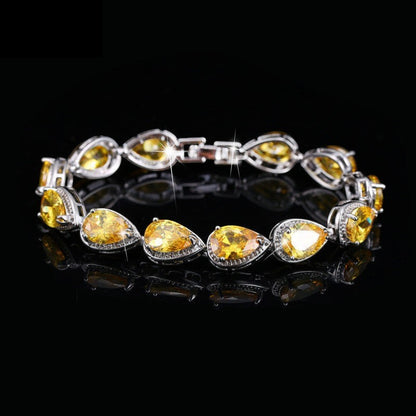 SWAGTOK yellow drop-shaped zircon tennis bracelet, platinum-plated copper, geometric design, 17.8cm length.